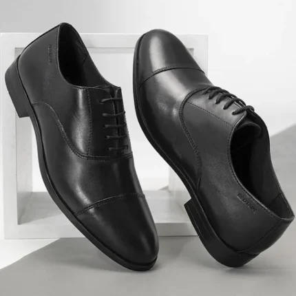 Premium leather OMNI Oxford Shoes for men – elegant formal footwear with classic closed-lace design.